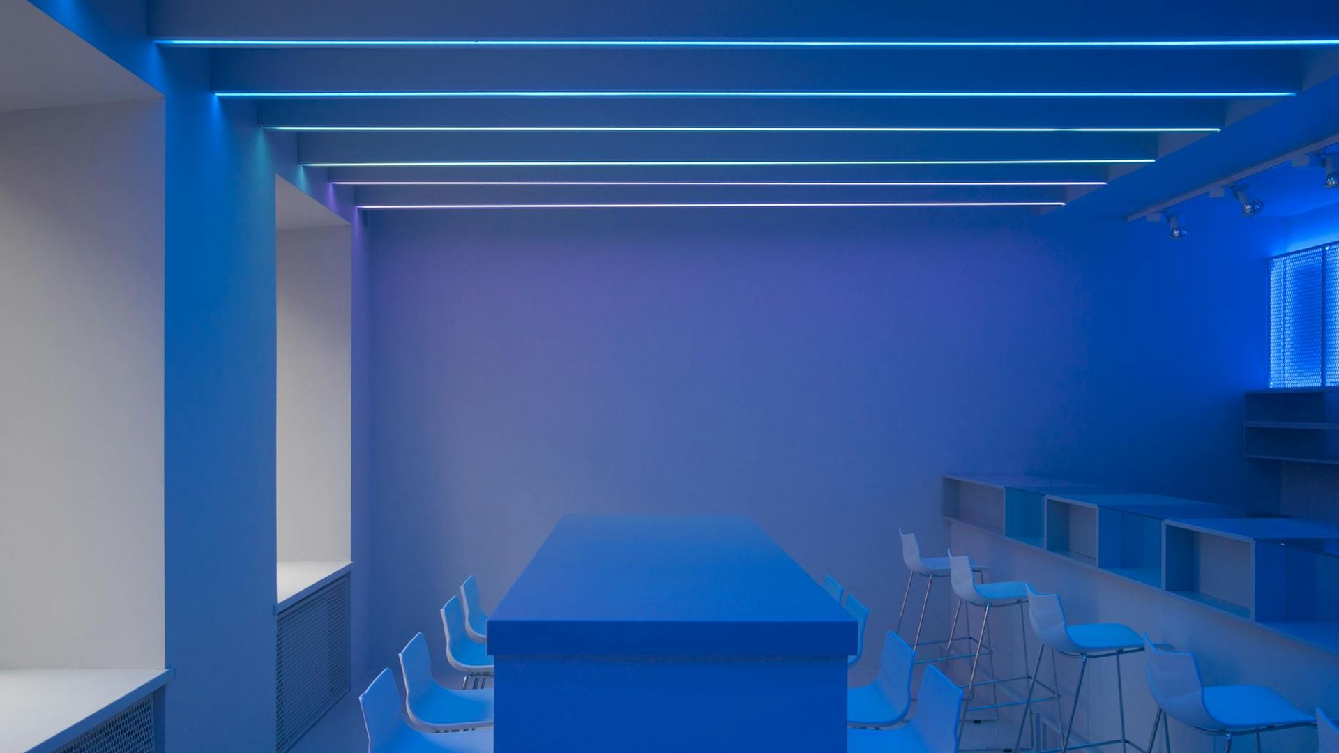 Futuristic workspace with soft neon blue ambient lighting