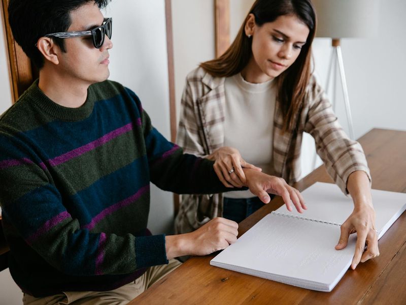 Hands holding a schematic guide of visual training
